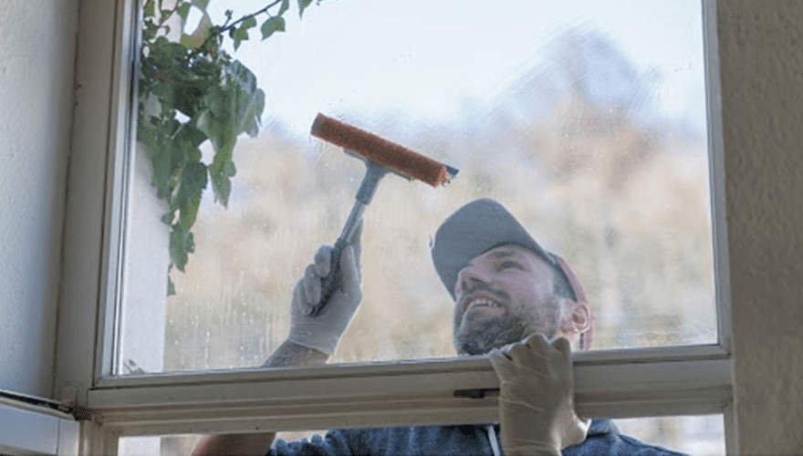 Man Cleaning a Window